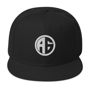 Black snapback cap with embroidered AG crest logo and subtle grey under visor.