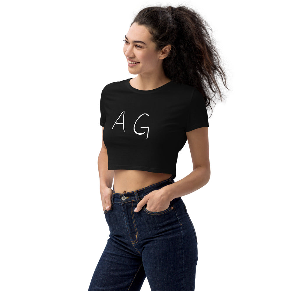 Woman wearing AG Attitude black crop top in a sexy pose