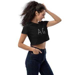 Woman wearing AG Attitude black crop top in a sexy side pose